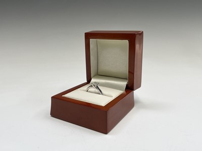 Lot 303 - An 18ct white gold ring set a novelty cut...