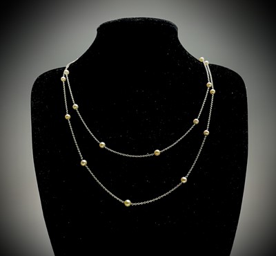 Lot 322 - A platinum 124cm chain spaced with 26 pearls