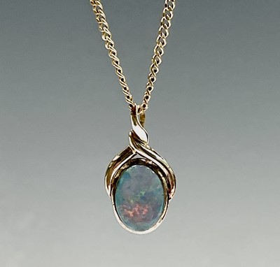 Lot 334 - A 14ct gold 40cm chain with an opal pendant...