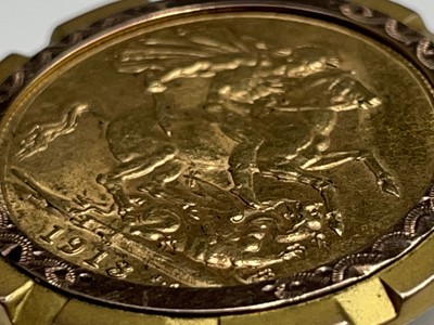 Lot 379 - A 1913 Sovereign in a yellow and rose gold 9ct...