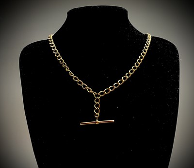 Lot 395 - A 9ct gold curb link 56cm chain with bar 26gm