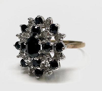 Lot 405 - An impressive 9ct gold dress ring illusion set...