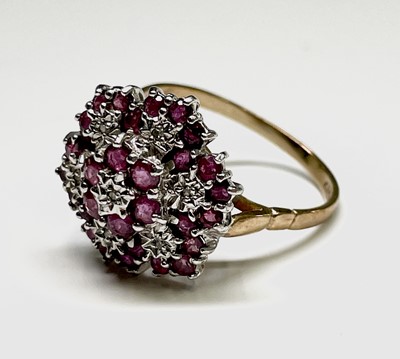 Lot 406 - An impressive 9ct gold dress ring illusion set...