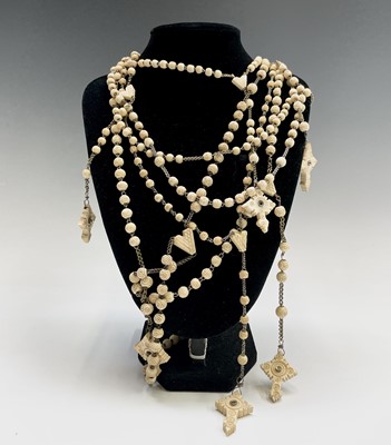 Lot 416 - Six rosaries each with a bone cross set with a...