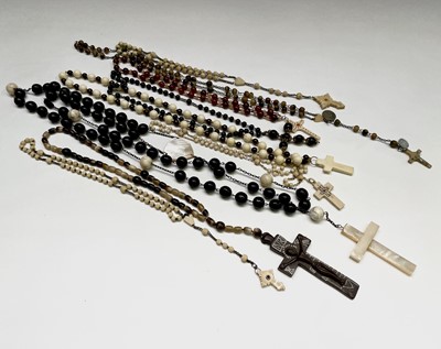 Lot 422 - Ten rosary bead necklaces, five with bone...
