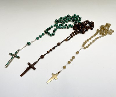Lot 424 - A rosary with malachite beads and silver and...