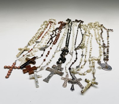 Lot 430 - Fourteen rosary bead necklaces, all with...