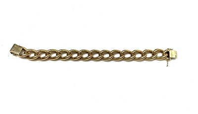 Lot 448 - A handsome 18ct gold curb link chain bracelet...