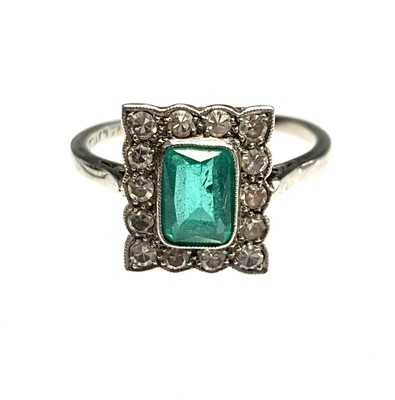 Lot 449 - An 18ct gold and platinum, diamond and emerald...