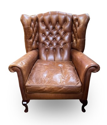 Lot 3169 - A George III style tan leather wing back...