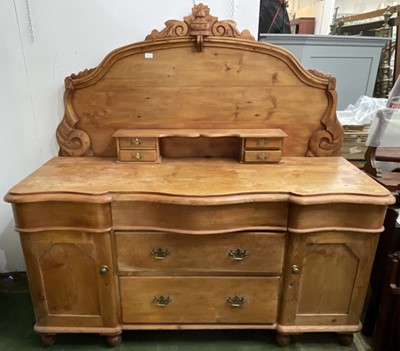 Lot 3211 - A 19th century stripped pine serpentine front...