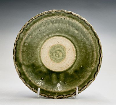 Lot 6 - A Chinese celadon dish, Ming Dynasty, with a...