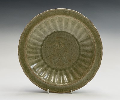 Lot 5 - A Chinese Longquan celadon dish, Ming Dynasty,...