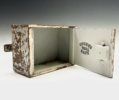 Lot 44 - A Chubb's steel wall safe, open but the key is...