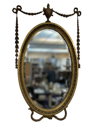 Lot 3132 - An Edwardian gilt gesso oval wall mirror, in...