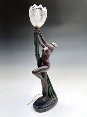 Lot 54 - An Art Deco style painted plaster table lamp,...