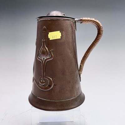 Lot 50 - An Arts and Crafts copper lidded jug, by...