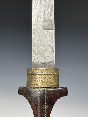 Lot 293 - A Kris, with carved wood grip and bone mounted...