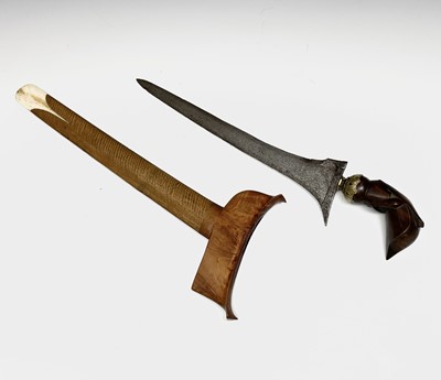 Lot 293 - A Kris, with carved wood grip and bone mounted...