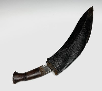 Lot 293 - A Kris, with carved wood grip and bone mounted...