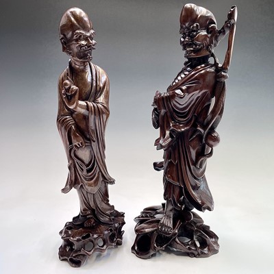 Lot 121 - Two Chinese carved wood figures, 19th century,...