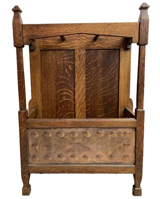 Lot 3124 - An Arts and Crafts oak three-division stick...