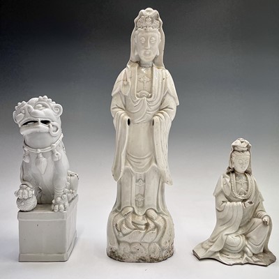 Lot 38 - A Chinese blanc de chine model of a dog of fo,...