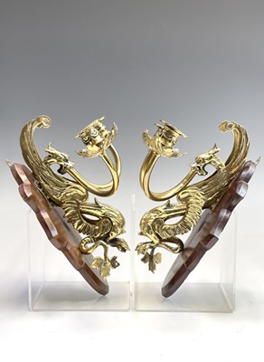 Lot 135 - A pair of Victorian brass dragon candle...