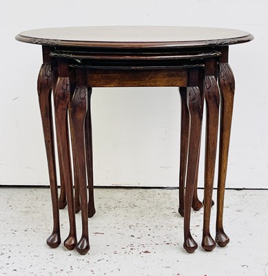 Lot 3224 - A nest of three walnut occasional tables, 20th...