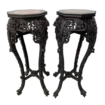 Lot 45 - A pair of Chinese carved hardwood jardiniere...