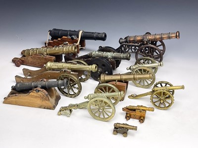 Lot 348 - A collection of thirteen brass and cast metal...