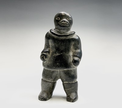 Lot 184 - An Inuit and carved stone figure, probably...