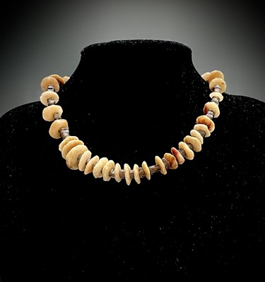 Lot 205 - An obsidian and flint necklace, together with...
