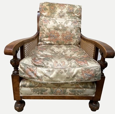Lot 3192 - A 1930s walnut and beech Bergere armchair,...