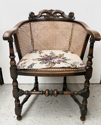 Lot 3194 - A 1930s walnut Bergere elbow chair, the caned...