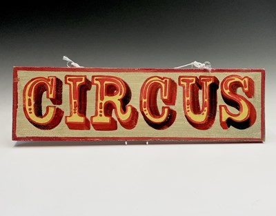 Lot 249 - A sign written wooden sign 'CIRCUS'. 19.5 x 66cm.