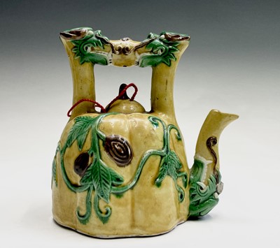 Lot 26 - A Chinese sancai-glazed teapot, the spout and...