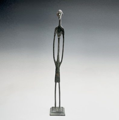 Lot 209 - An African bronze figure of elongated form,...