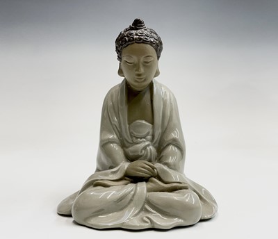 Lot 208 - A Chinese Shiwan porcelain figure of a seated...