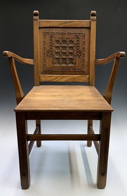Lot 3156 - An Arts and Crafts oak elbow chair, the panel...