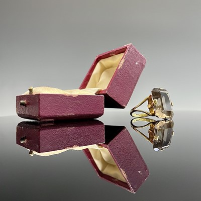 Lot 159 - A 9ct gold ring set a topaz of approximately...