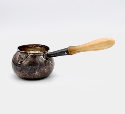 Lot 46 - A Georgian provincial silver brandy pan with...
