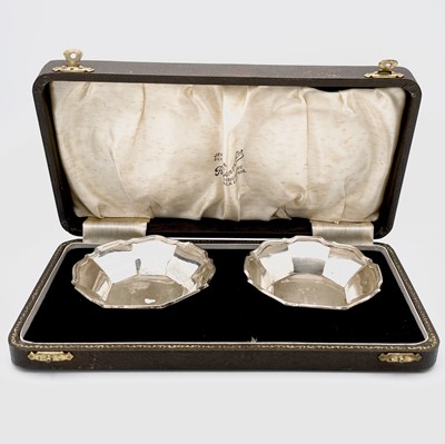 Lot 24 - A pair of shaped octagonal silver sweetmeat...