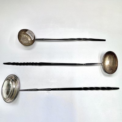 Lot 75 - Three Georgian silver punch ladles