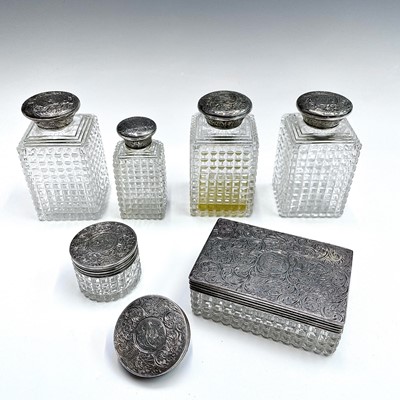 Lot 92 - A set of three Victorian cut glass jars with...