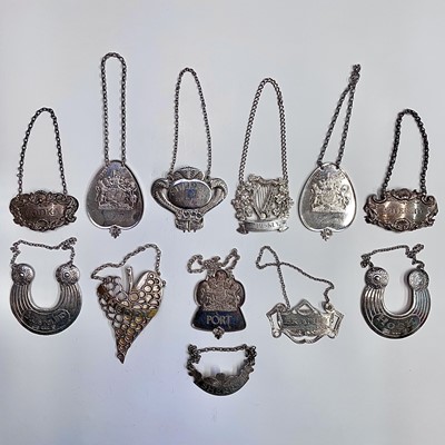 Lot 102 - Twelve Post-war silver wine labels including...
