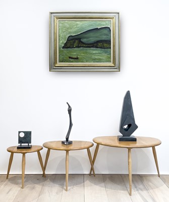 Lot 289 - An Ercol pale elm pebble nest of three tables,...