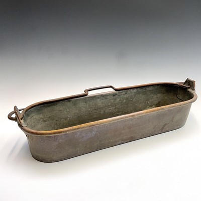 Lot 254 - A Victorian copper fish kettle, with iron...