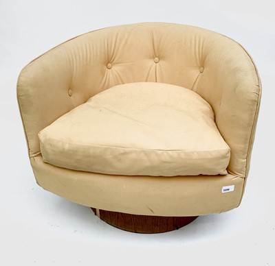 Lot 3256 - A stylish upholstered swivel armchair, with...