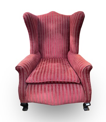 Lot 3170 - An early 20th century red upholstered wing...